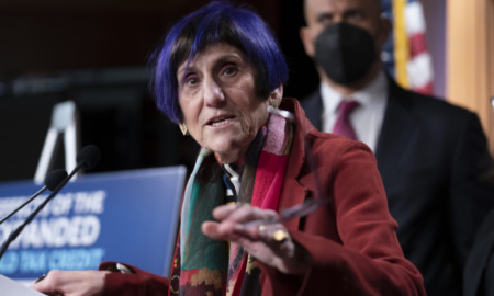 Rep. Rosa DeLauro Q&A on afterschool and child tax credit: older woman with blue hair speaking at podium with hand raised