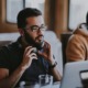 diversity and equity in U.S. apprenticeships: young ethnic man with glasses putting on headphones at computer