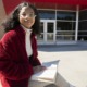 black girls see themselves in Supreme Court pick: young black girl with glasses reading a book in front of library entrance