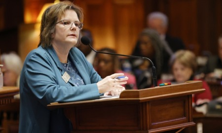 Georgia House votes to prosecute 17 year olds as adults: white woman with short brown hair speaking into mic at podium