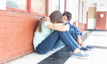 conflict resolution, inclusion, anti-hate and anti-bullying grants; teen comforting other teen at school