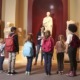 museum improvement, humanities education: young students and teacher at history museum