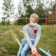 homeless: Teenage boy on playground in mask.