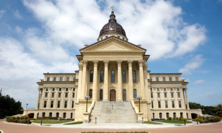 Kansas law reading skills: Kansas State Capitol builing traditional architecture cream-colored with dome centertop