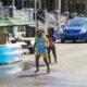 Playstreets Philadelphia: 2 young children play in the street