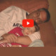 restoration, not prison video: screenshot of man and son sleeping on couch