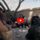 Homeless New Mexico youth: Circle of homess teens sit in circle on cement under leafless tree