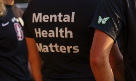 Social workers: Mental health toll unprecedented: view of person wearing black t-shit with "Mental Health Matters" on the back