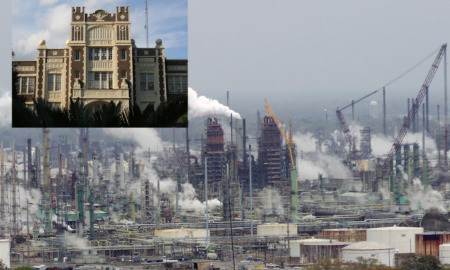 Tax Rebates cost schools: Long view of an oil refinery with dozens of smoke stacks belching white smoke and insert of a traditional red brick building with very ornate white trim