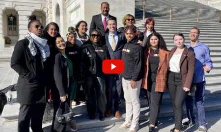 Youth Adult Tax Credit: Group of several people stand together in two rows on steps of large white cement building with white pillars