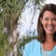 YMCA names Suzanne McCormick first woman president and CEO: smiling, brunette woman in front of palm trees