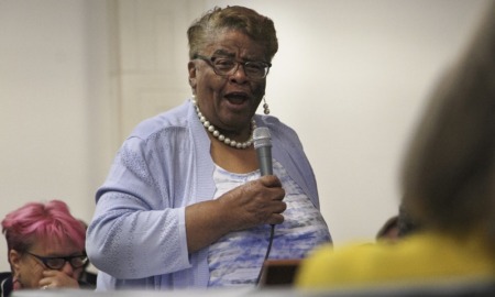 North Carolina House passes bill limiting racial teachings: older black woman talking animatedly into microphone