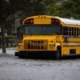 Schools after disasters, rebuilding after Helene and Milton: school bus stopped in flood waters