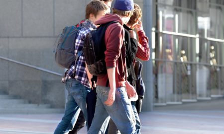 youth-w-backpacks-walking-on-street