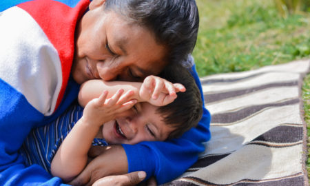 Tender portrait of native american woman with her little son