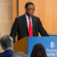 Adewale Adeyemo newsmaker; young african american man in glasses giving speech at podium