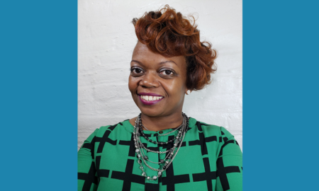 Monique Cox newsmaker headshot; African American woman smiling