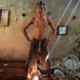 Toxic Truth Report; young child worker standing in room with discarded metals