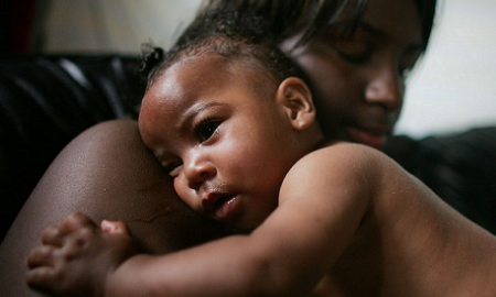 racial disparities in maternal and infant health report; Shanika Reaux holds her baby