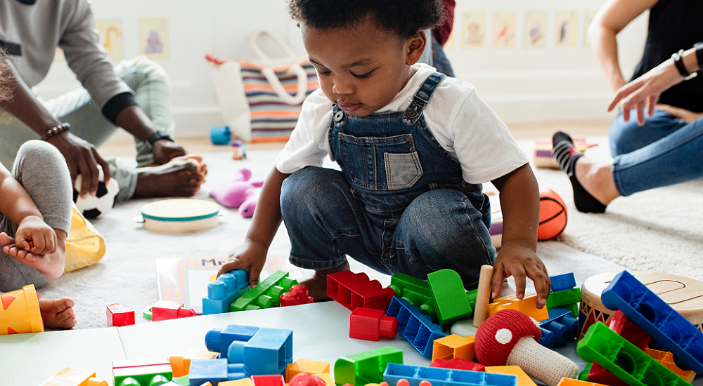 child care policy: young children playing at child care center