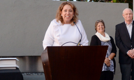 Sandra Gasca-Gonzalez newsmaker talking at podium